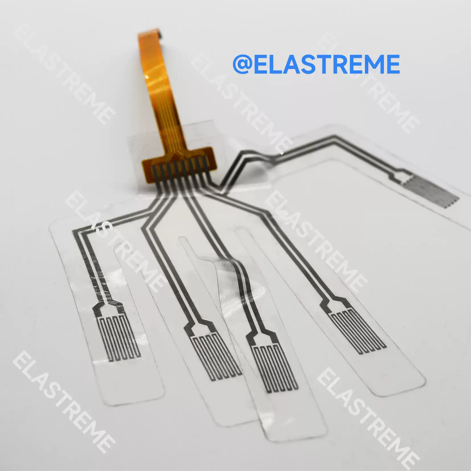 Elastreme Sense Manu-5D Electronic Skin and Data Glove — Manu-5D flexible sensor film with five finger sections and ribbon connector.