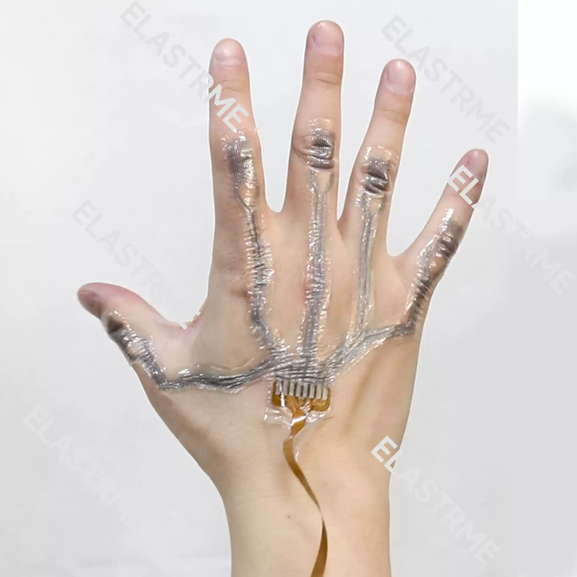Elastreme Sense Manu-5D Electronic Skin and Data Glove — Flexible electronic skin sensor demonstrated on the back of a hand.