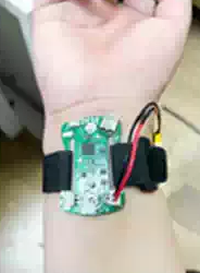 Sichiray Single-Channel sEMG Sensor Armband Development Kit — Supplier demonstration of the sensor board worn on a wrist with an illuminated indicator.